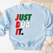 a blue sweatshirt with the words just dua it printed on it